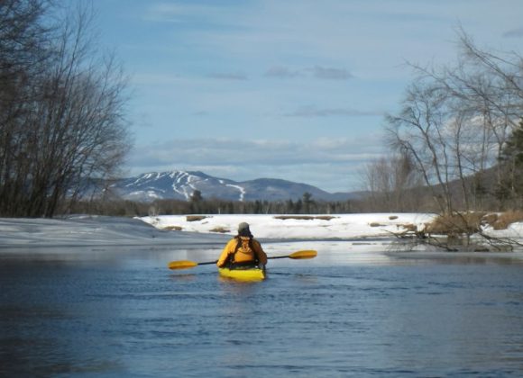 person kayaking in Mont Tremblant during winter